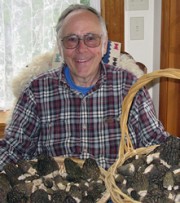 Michael Beug with a basket of black morel mushrooms